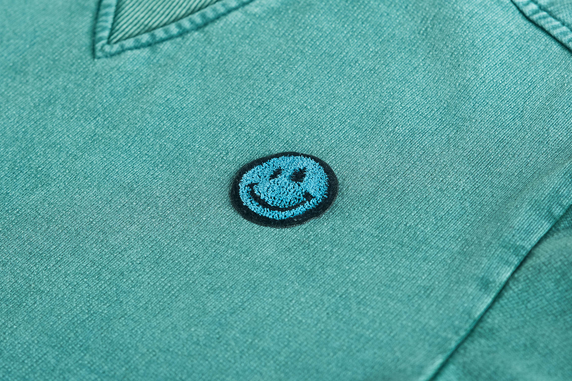 Smiley Pullover grün